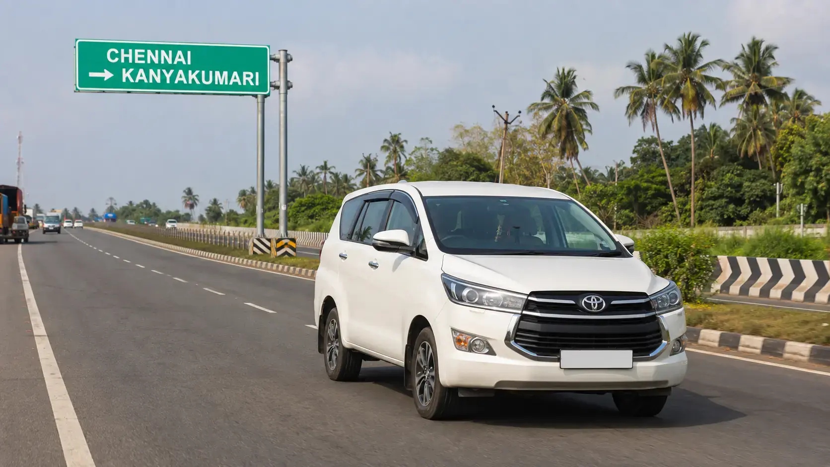 Chennai to Kanyakumari Taxi Route White drop taxi travelling on the Chennai to Kanyakumari route on a South Indian bypass highway