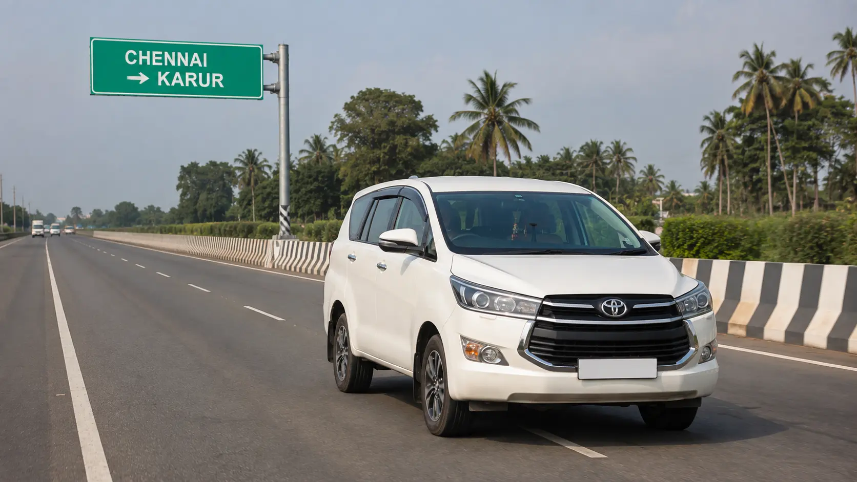 White one-way drop taxi travelling from Chennai to Karur on a Tamil Nadu bypass highway